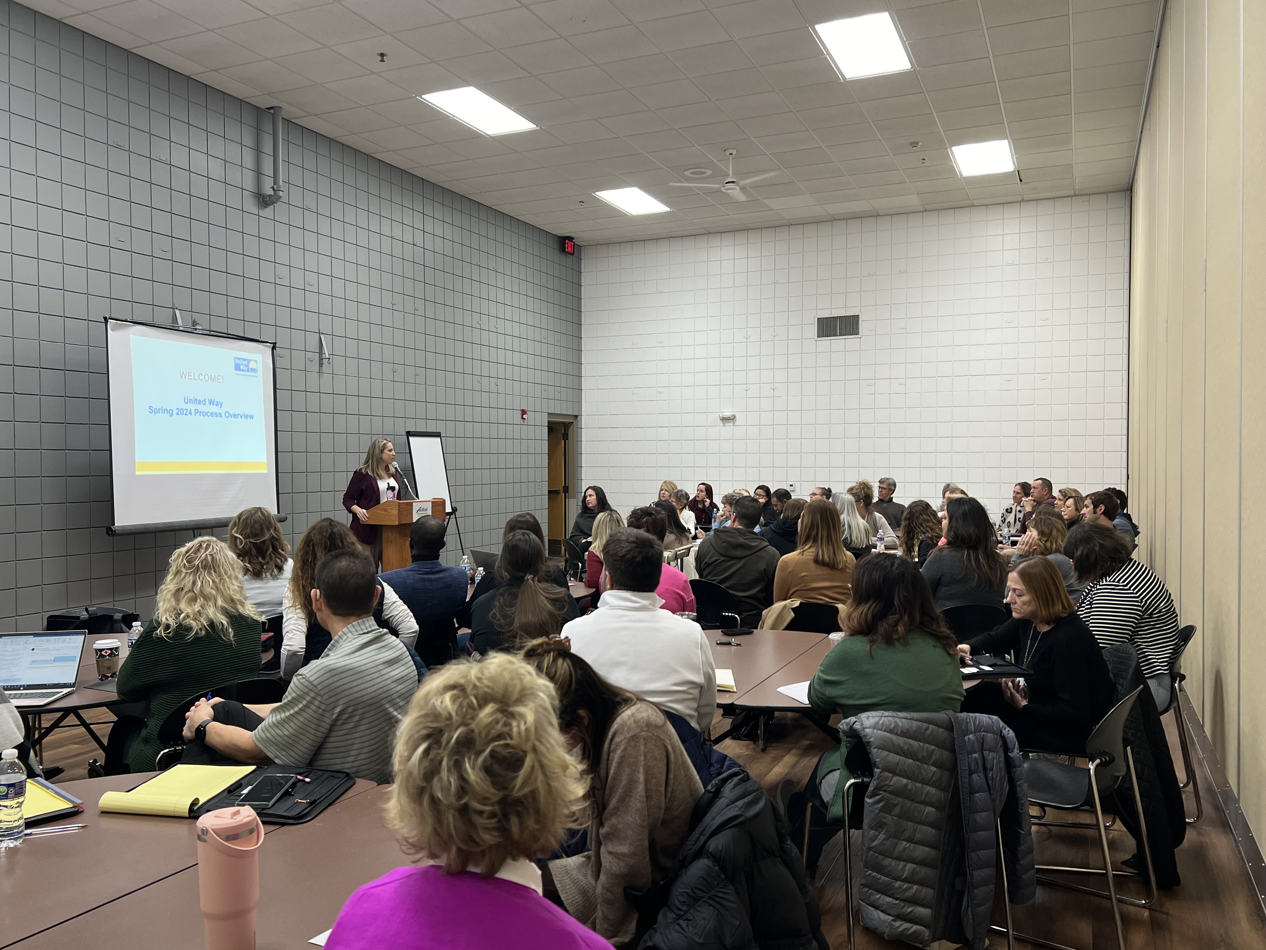 Adrienne McKeown presenting SEUW funding application training at Active Generations to a room full of agency staff. 