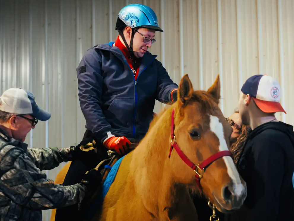 HorsePower volunteers assisting a rider