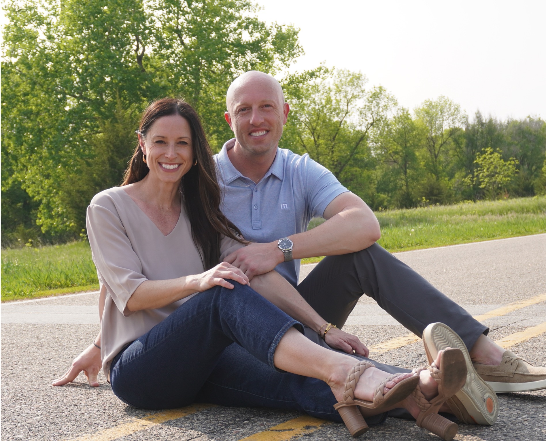 Jamie Hegge and her husband posing outdoors.