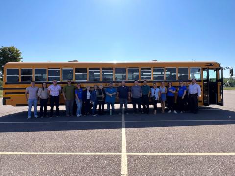 Sioux Empire United Way Volunteers Standing In Front of Bus for Agency Tours